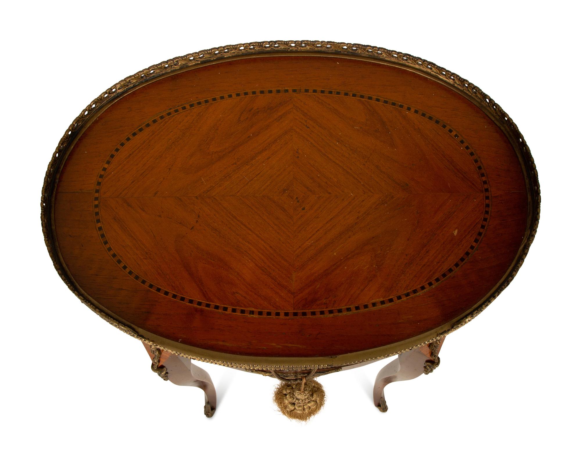 A Louis XV/XVI Transitional Style Gilt Metal Mounted Fruitwood Side Table