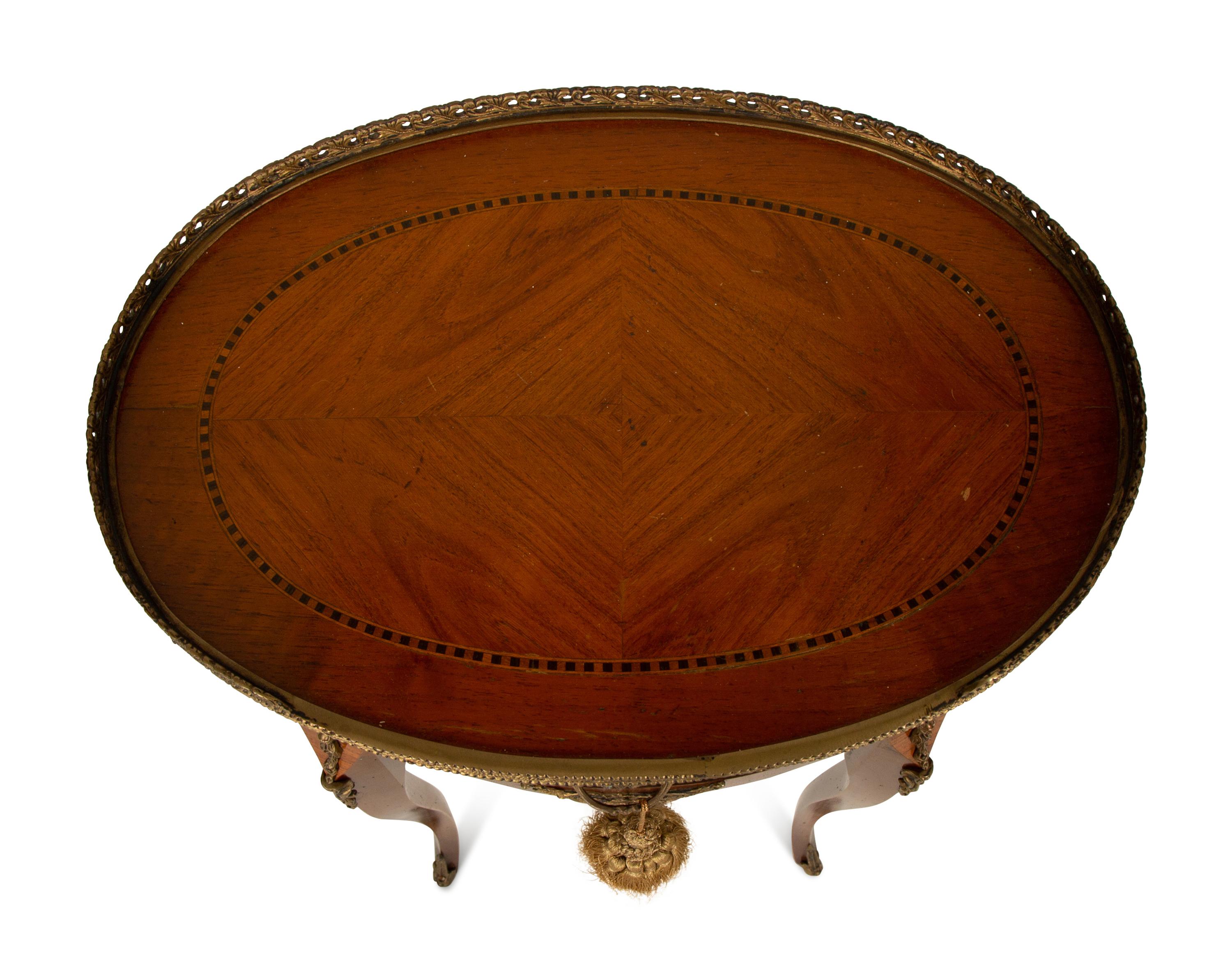 A Louis XV/XVI Transitional Style Gilt Metal Mounted Fruitwood Side Table