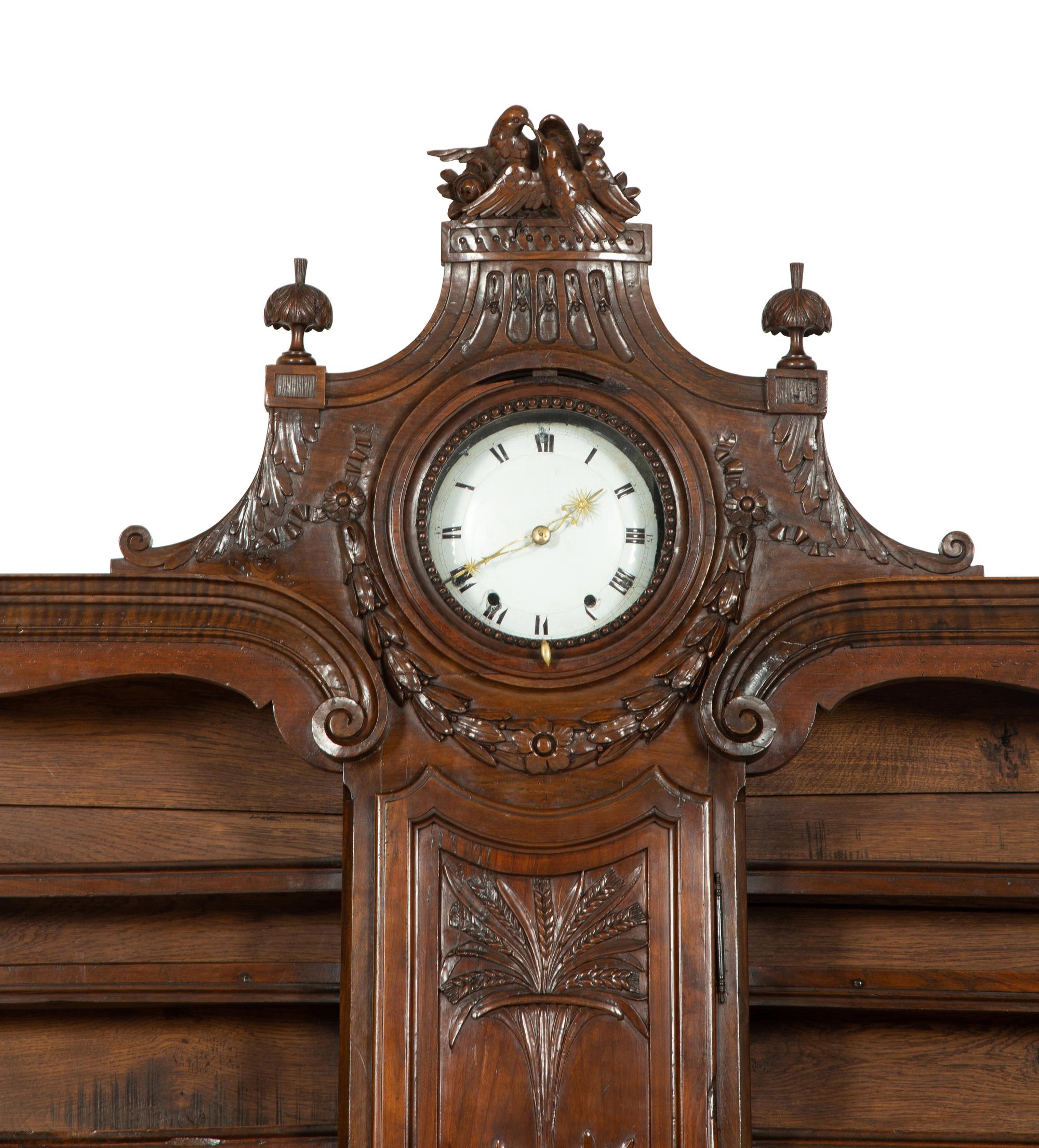 A French Provincial Carved Walnut Clock-Inset Vaissellier