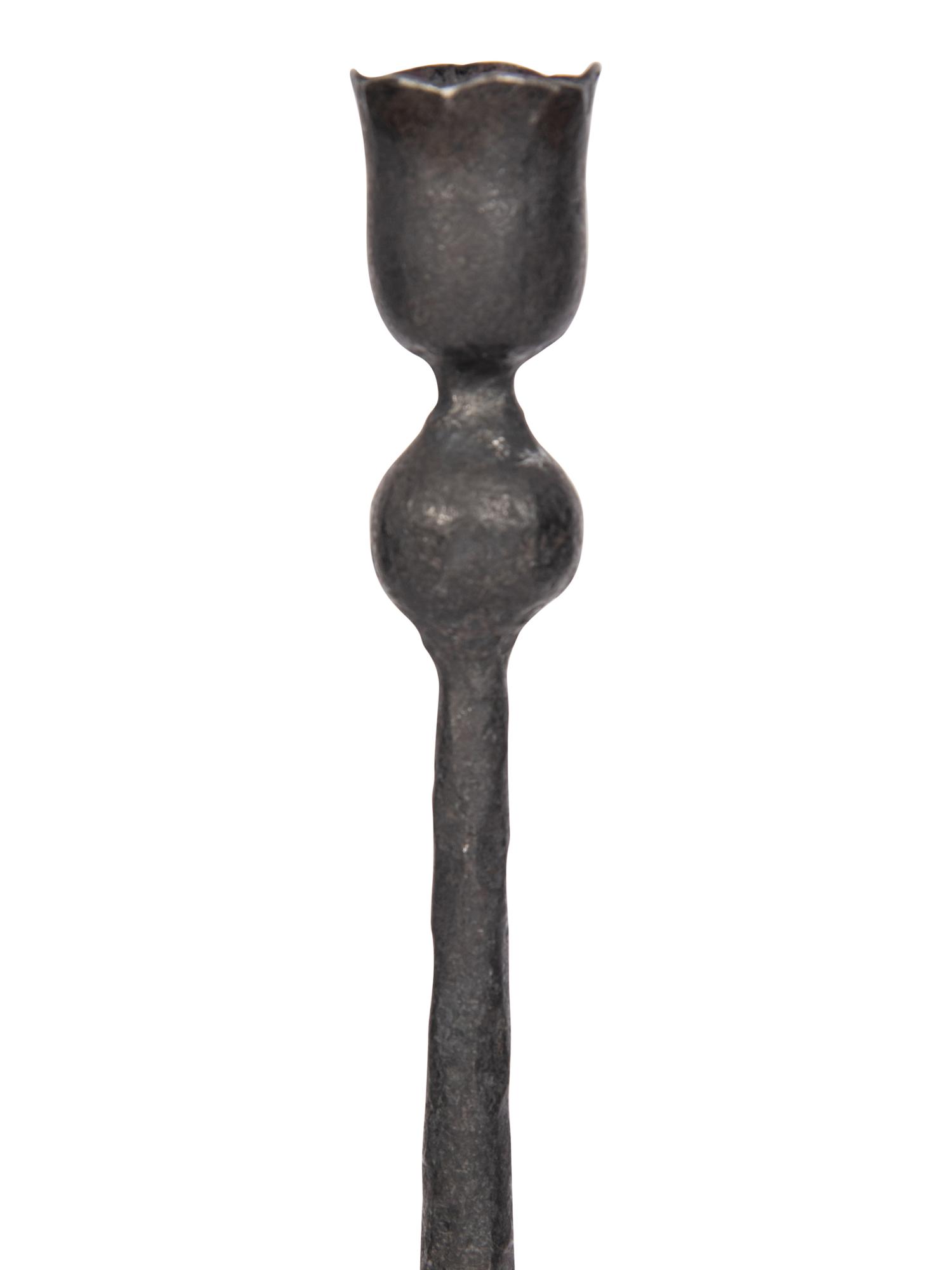 A Set of Eight Wrought Iron Candlesticks