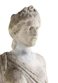 A Carved Marble Figure of a Maiden with Garlands