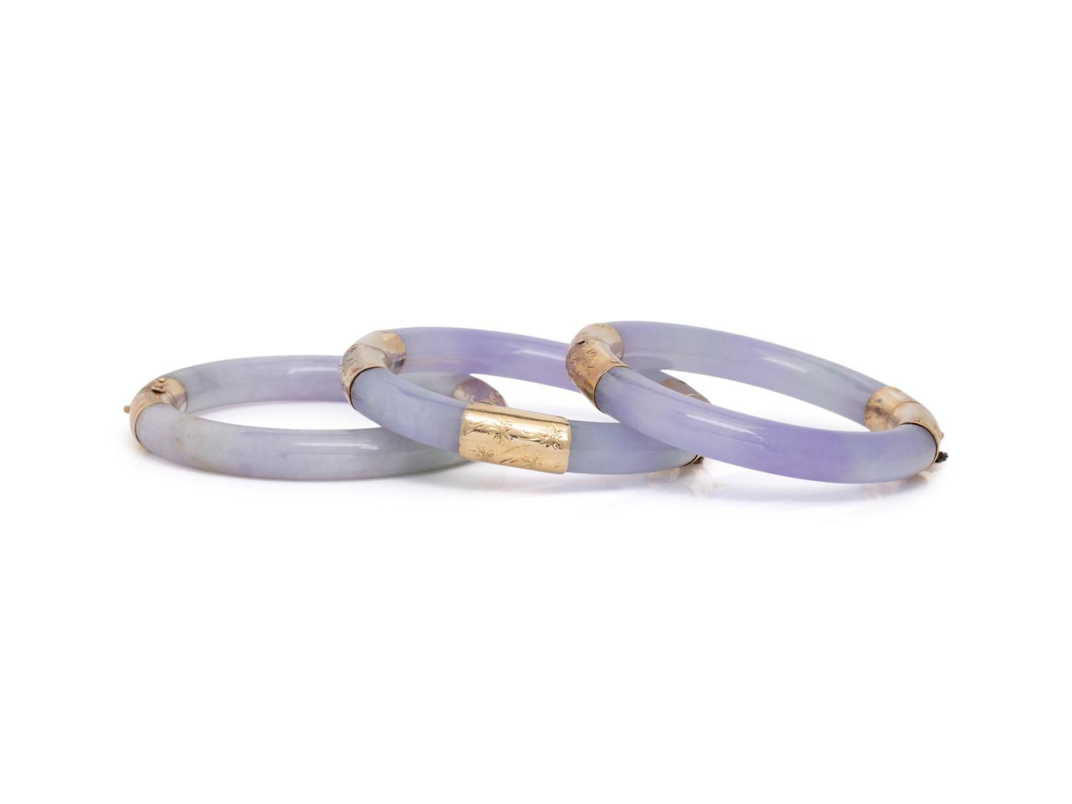 THREE JADE AND YELLOW GOLD BANGLE BRACELETS