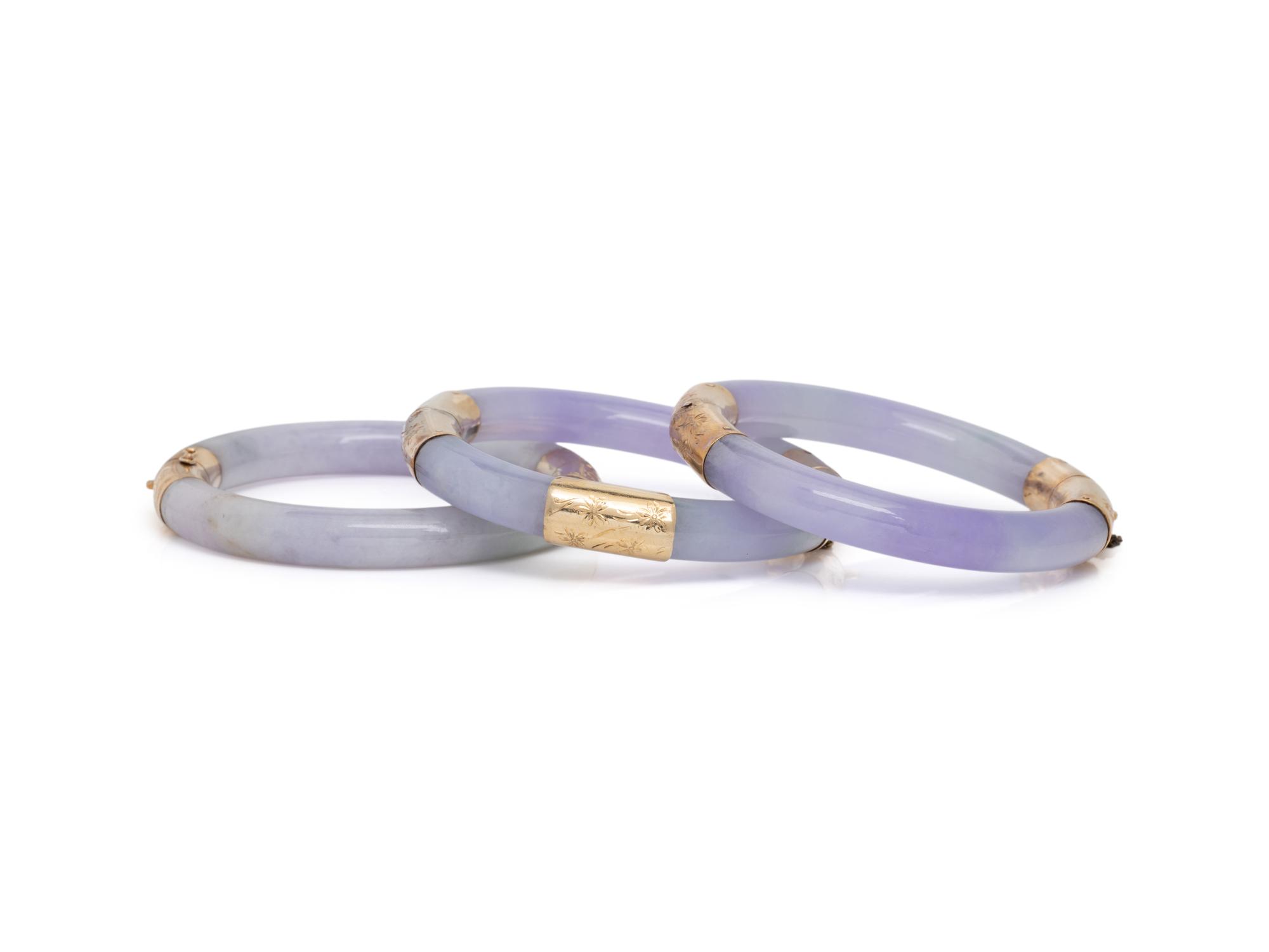 THREE JADE AND YELLOW GOLD BANGLE BRACELETS