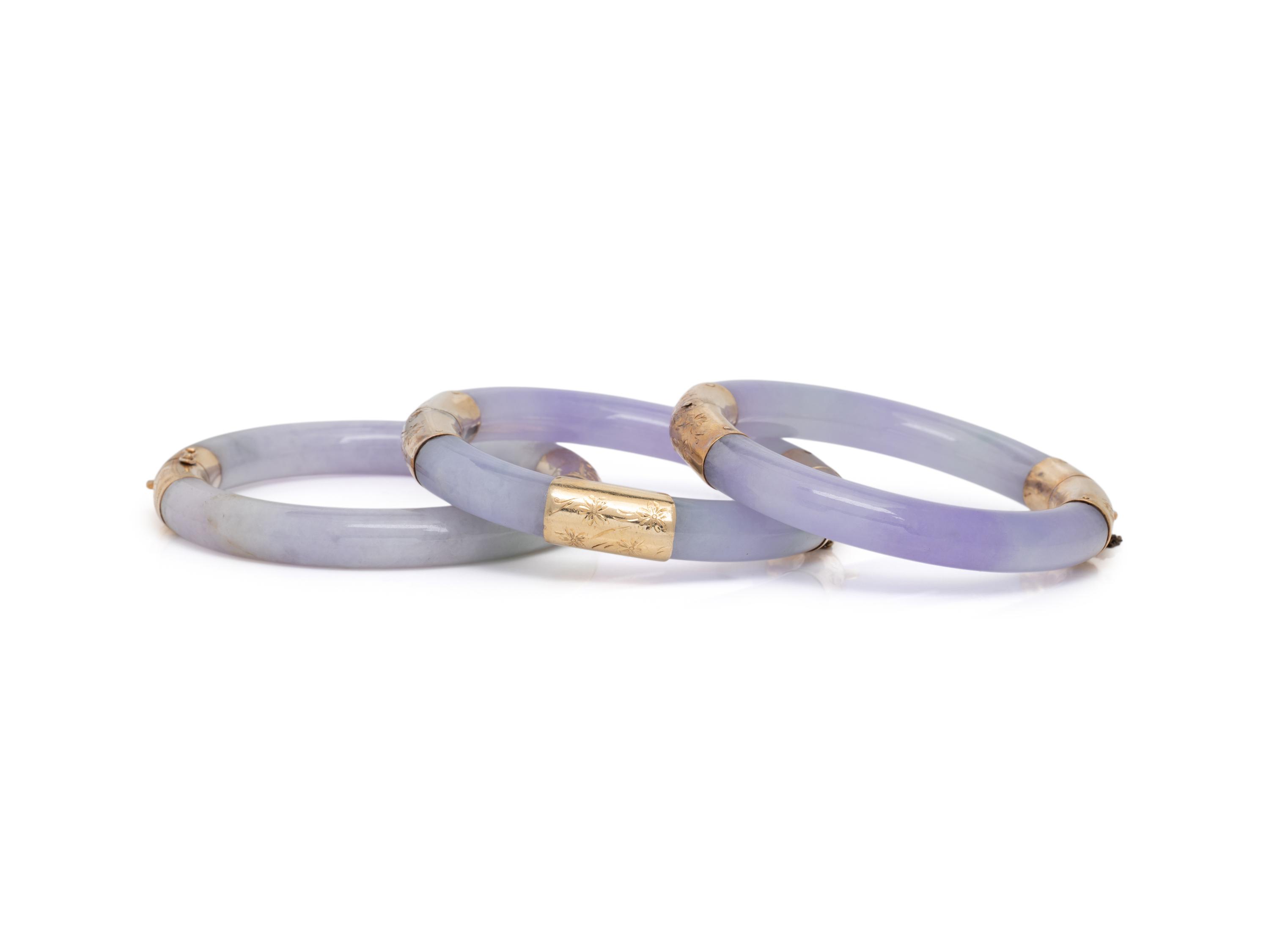 THREE JADE AND YELLOW GOLD BANGLE BRACELETS