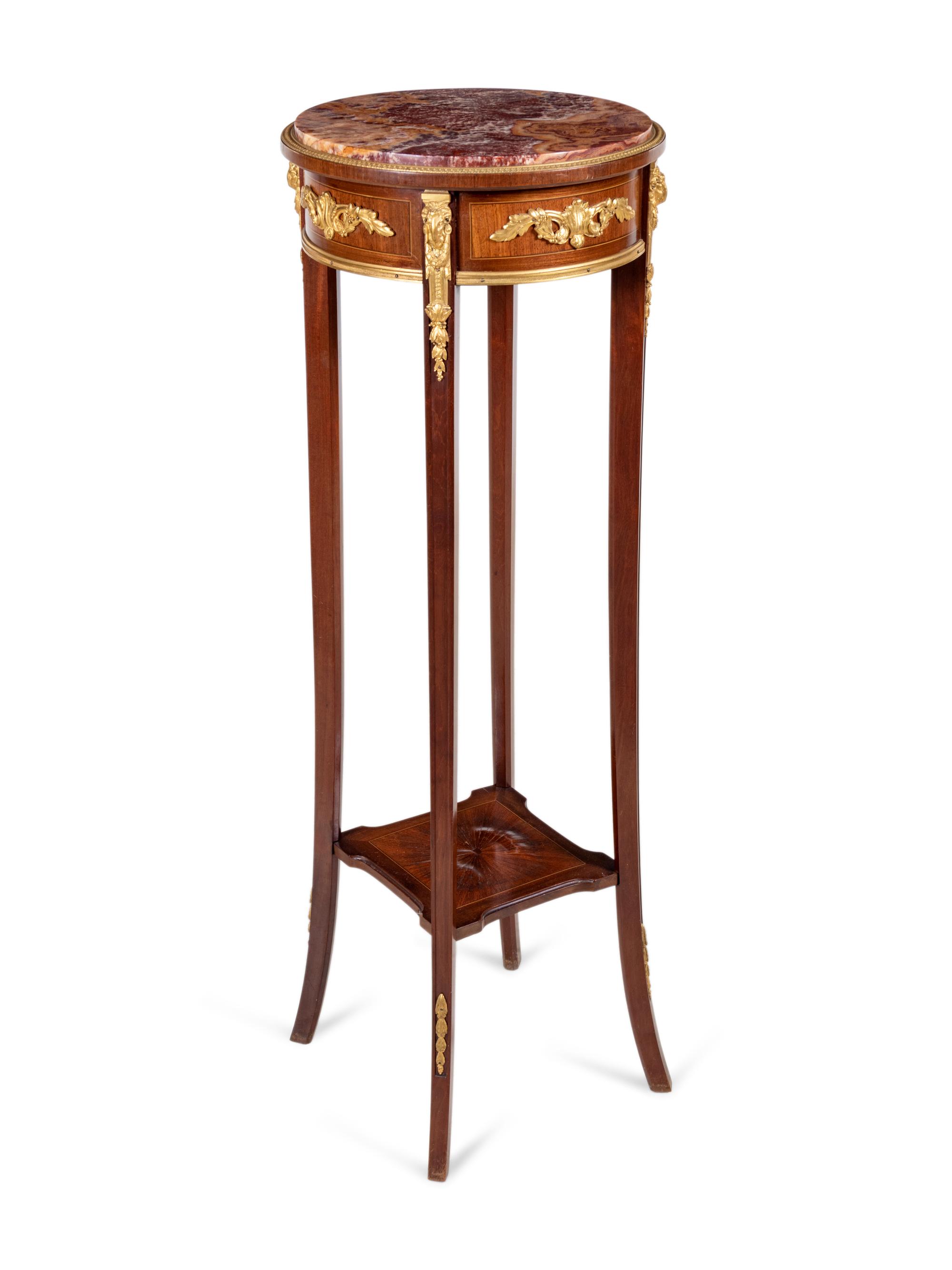 A Louis XVI Style Gilt Bronze Mounted Mahogany Marble-Top Pedestal Table