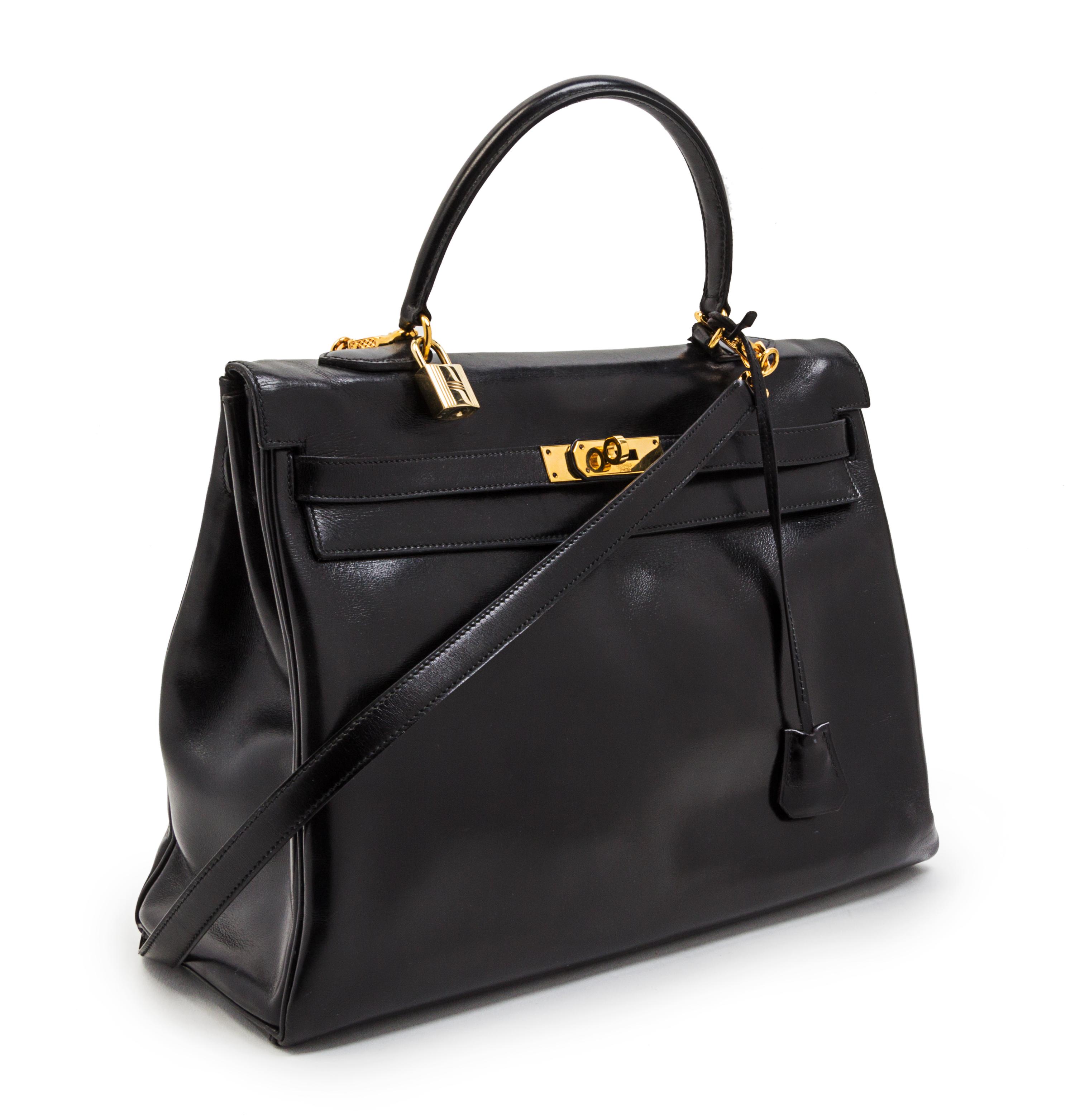 An Hermes 35cm Black Leather Kelly Bag, 14 x 8 x 7 inches.