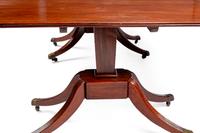 A Regency Mahogany Three-Pedestal Dining Table