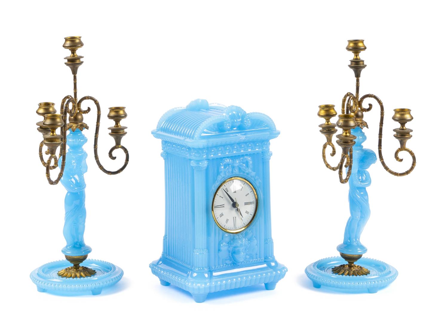 A Continental Blue Opaline Glass Three-Piece Clock Garniture