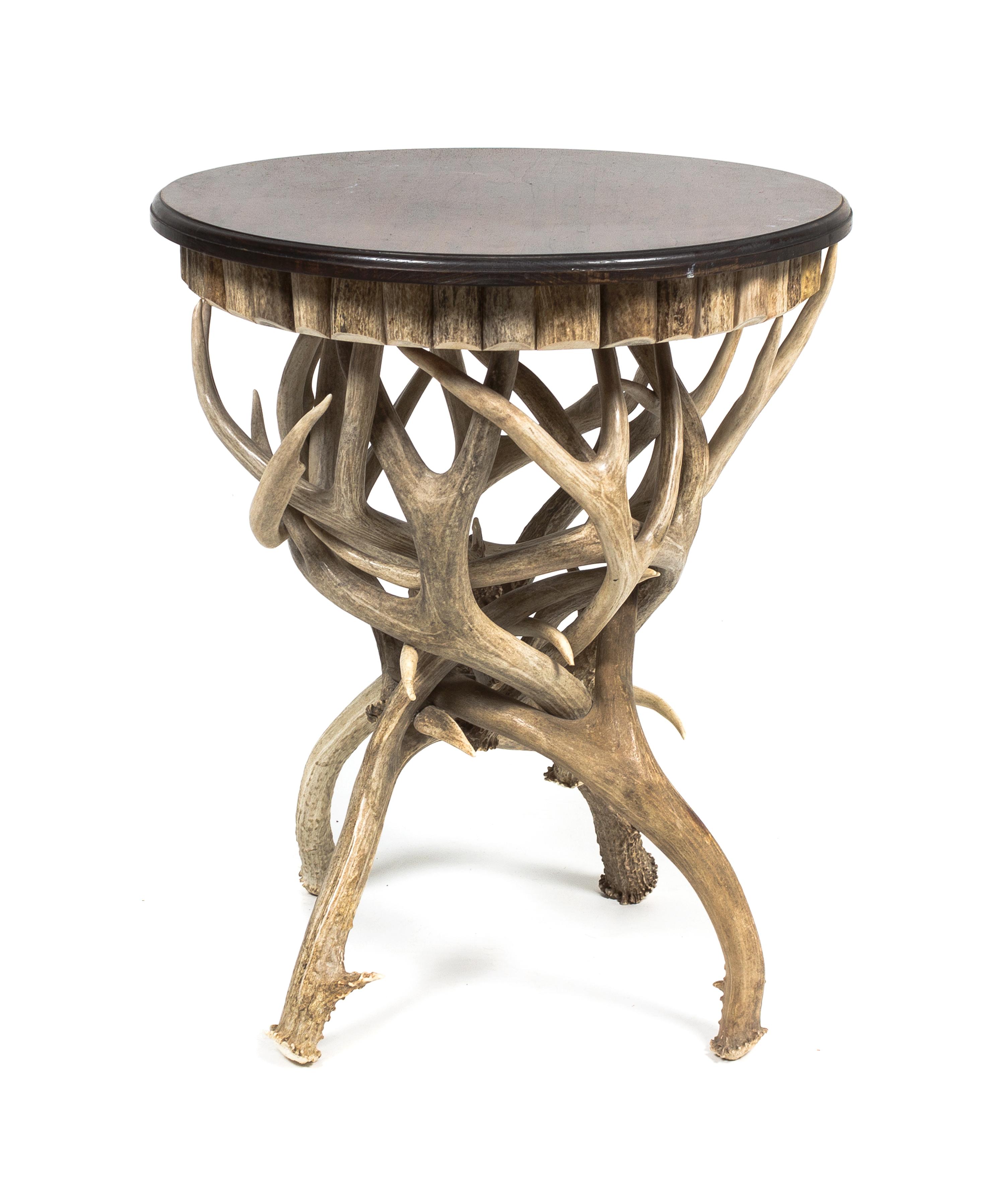 A Contemporary Antler Leg Circular Top Table Height 24 x diameter 19 1/2 inches.