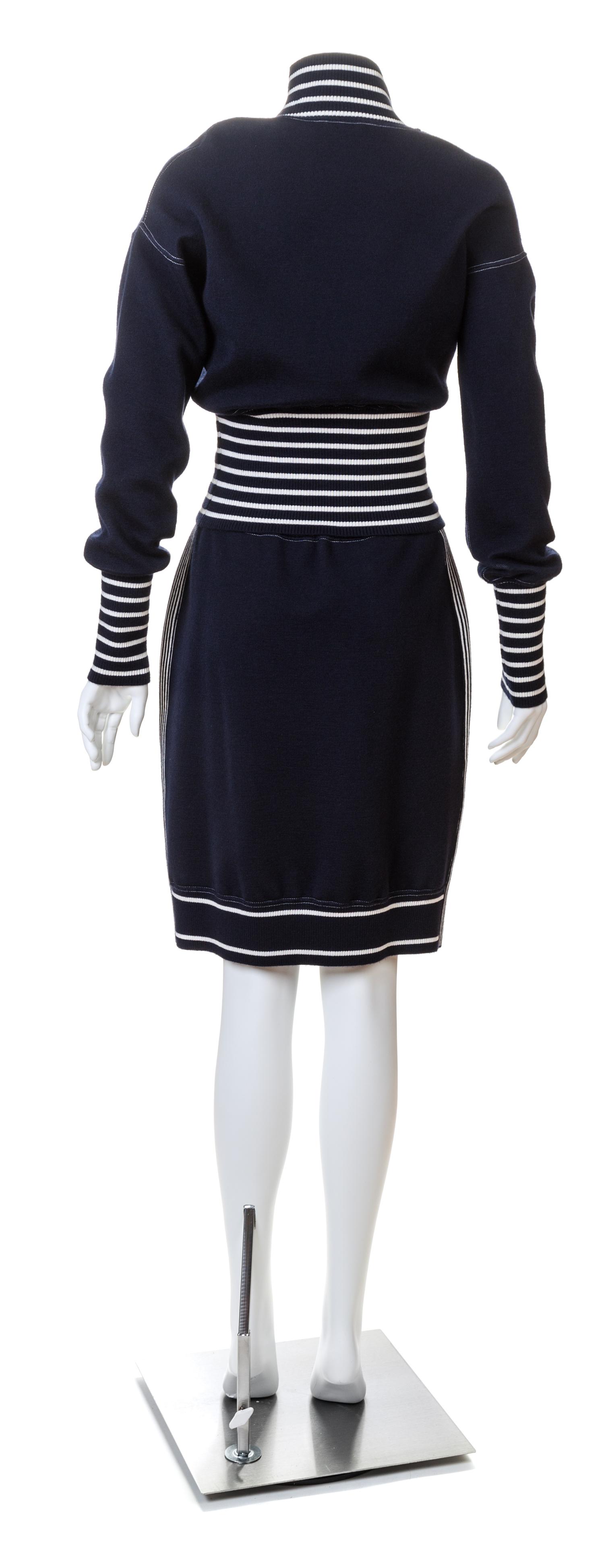 A Chanel Navy Three Piece Jacket and Skirt Ensemble, Jacket and skirt size 42, Top size 40.