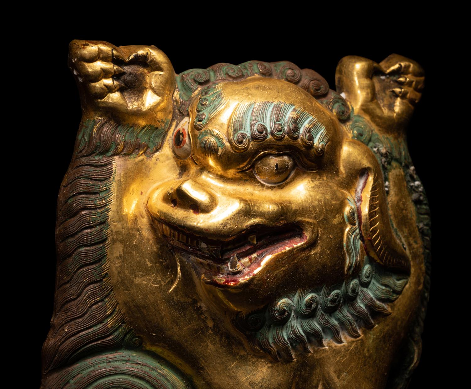 A Sino-Tibetan Gilt Bronze Repoussé Fu-Lion
