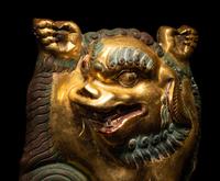 A Sino-Tibetan Gilt Bronze Repoussé Fu-Lion