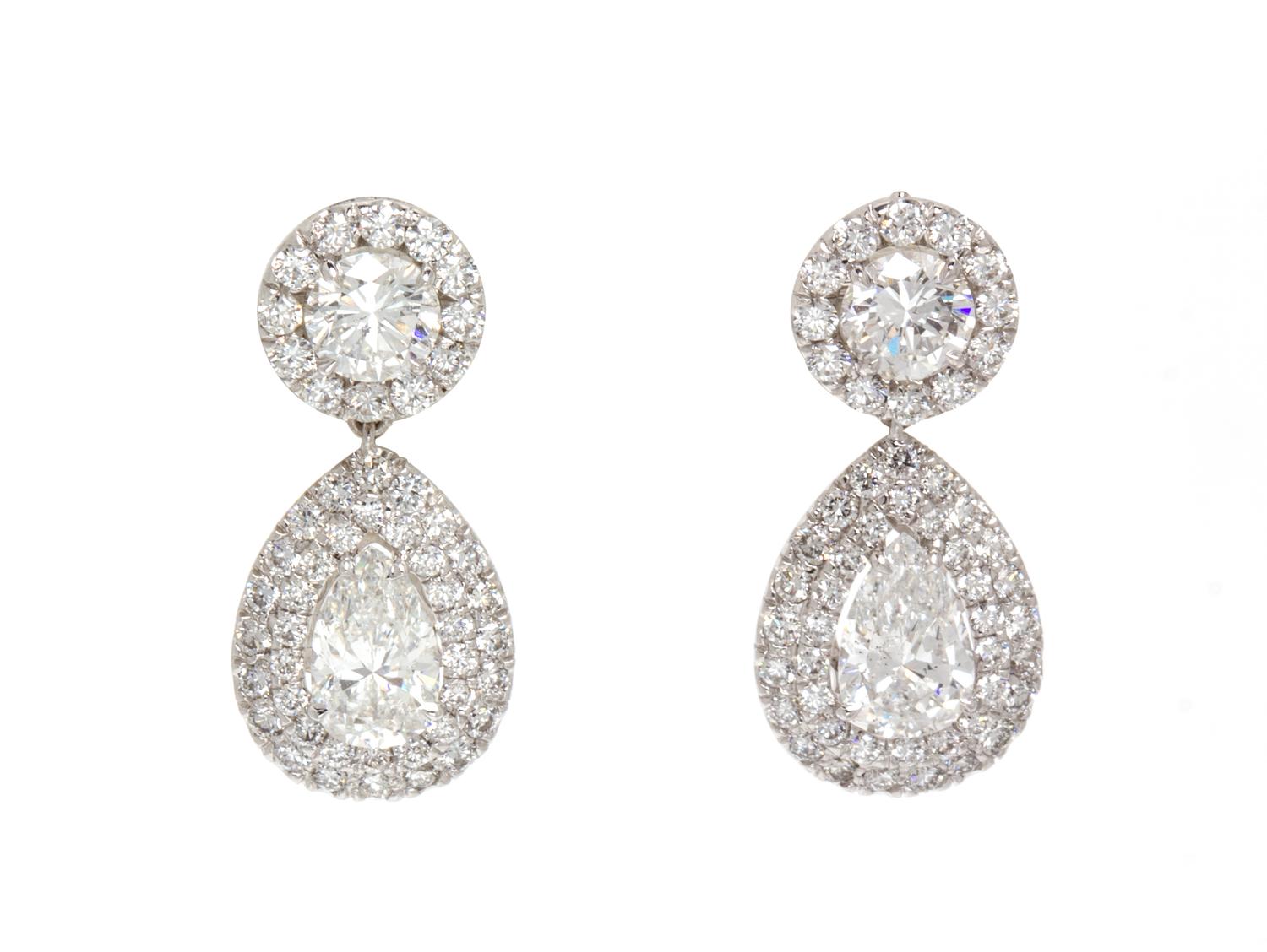 A Pair of 18 Karat White Gold and Diamond Drop Earrings, 3.90 dwts.