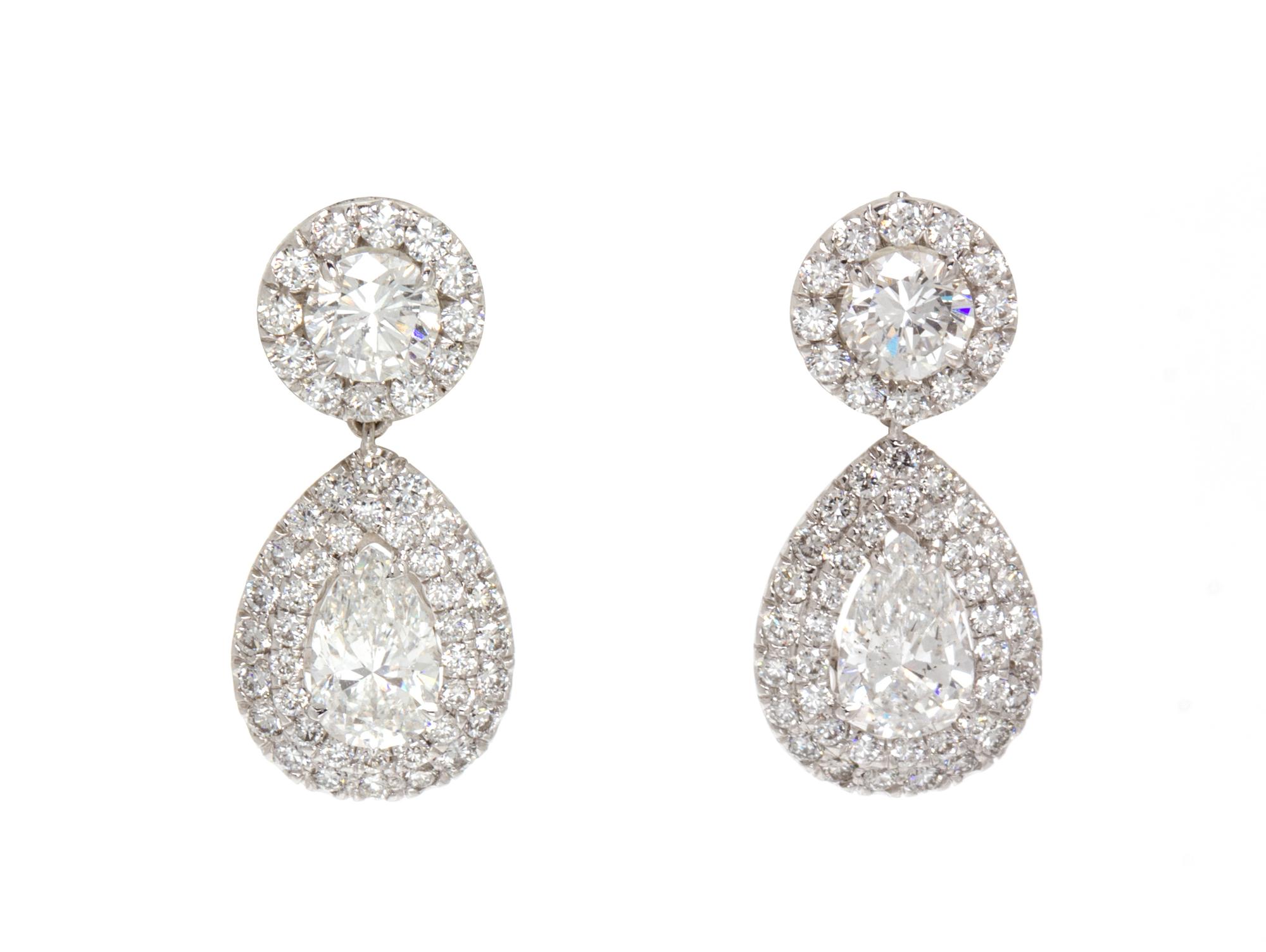 A Pair of 18 Karat White Gold and Diamond Drop Earrings, 3.90 dwts.
