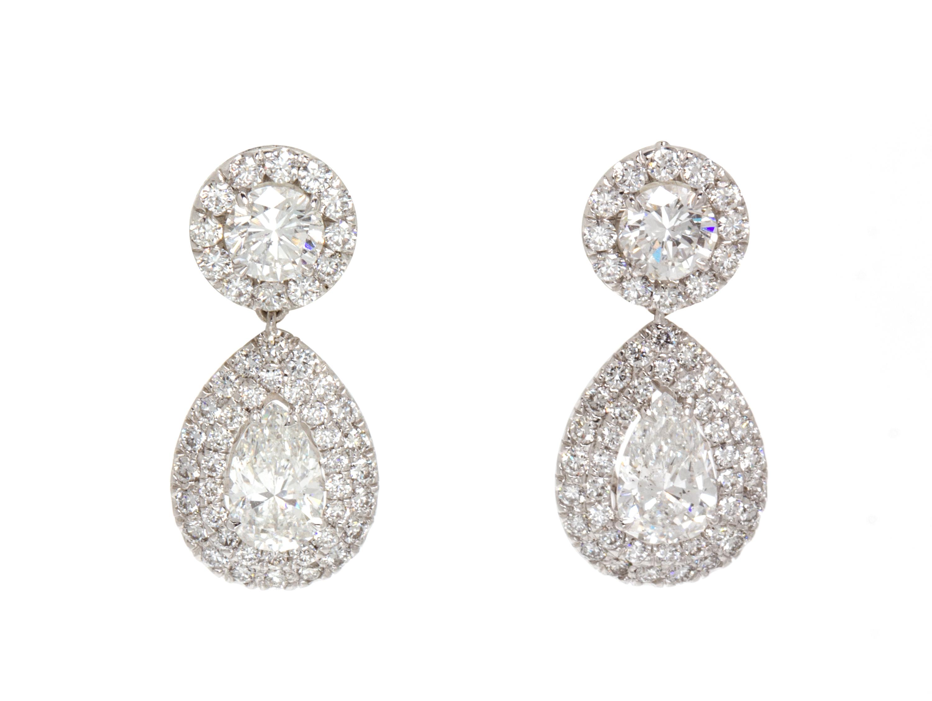 A Pair of 18 Karat White Gold and Diamond Drop Earrings, 3.90 dwts.