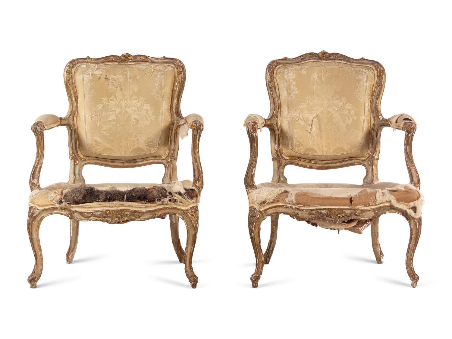 A Pair of Louis XV Parcel Gilt Fauteuils
