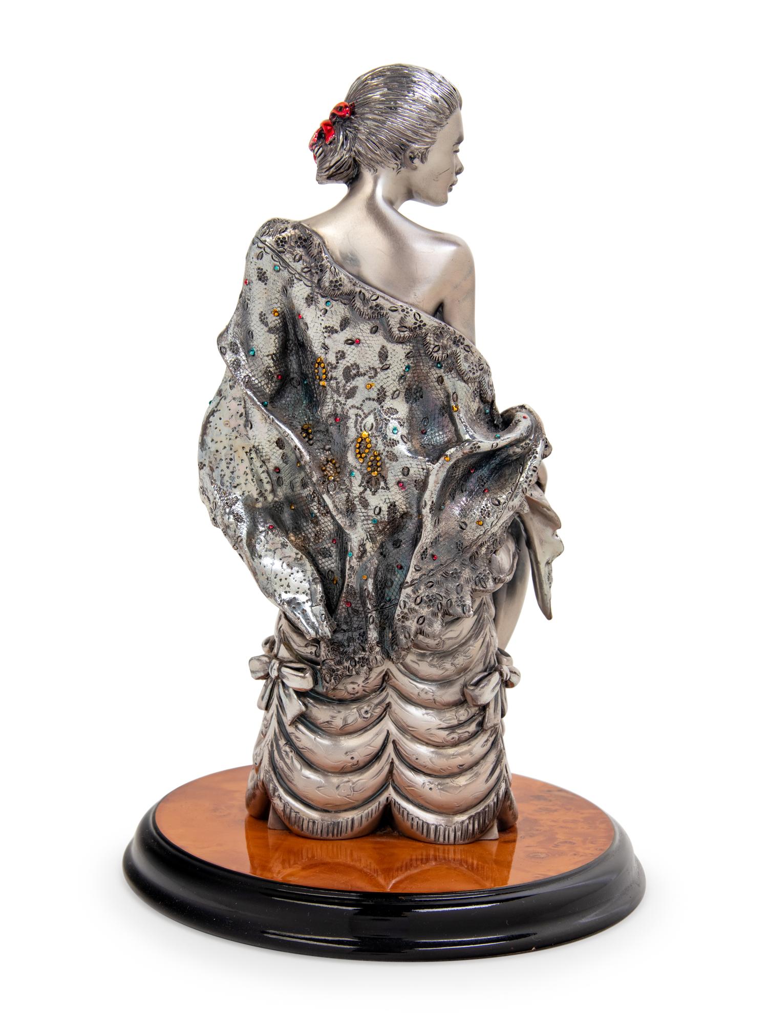 An Italian Silver Figure of a Lady