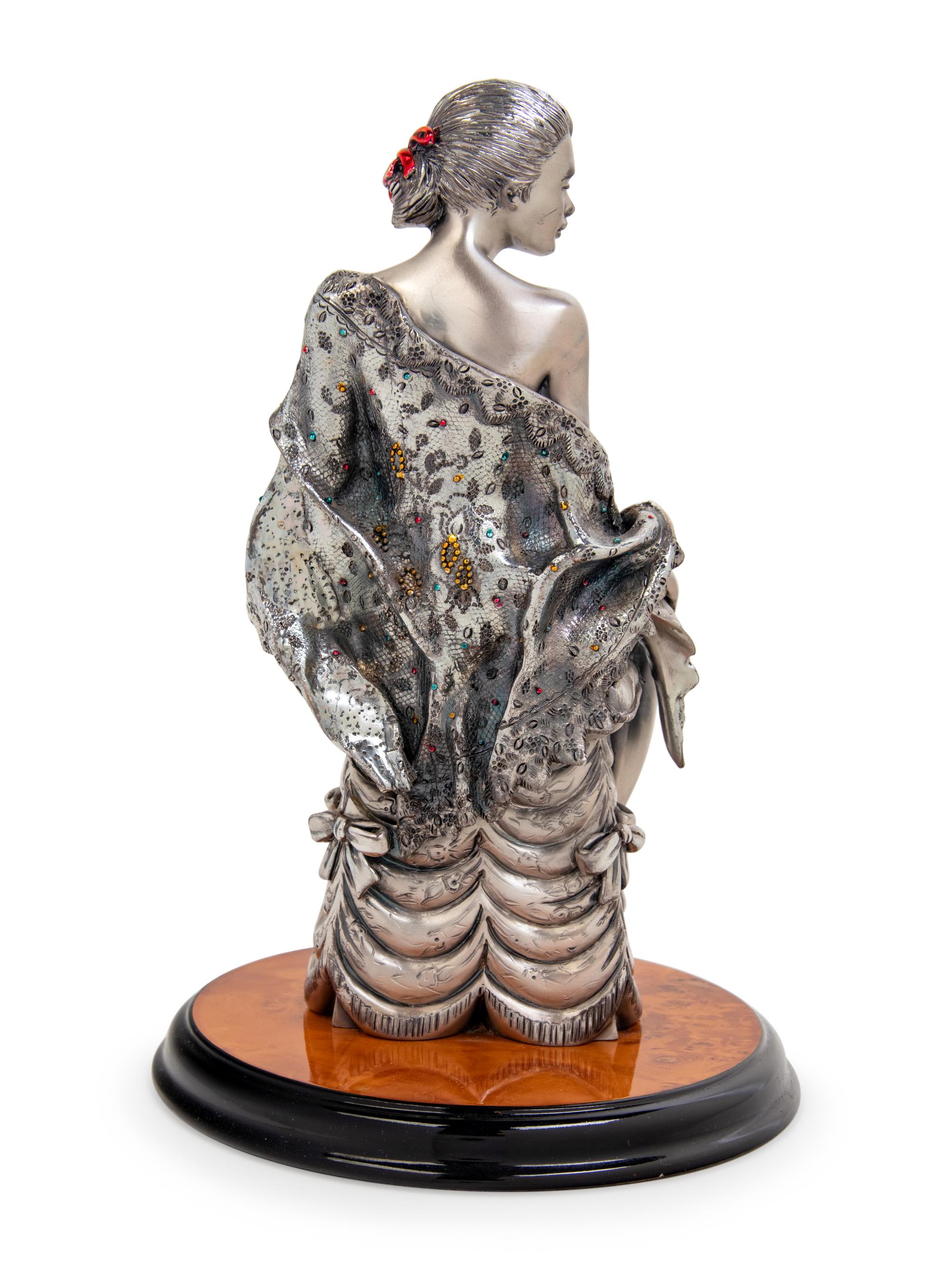 An Italian Silver Figure of a Lady