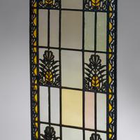 Window with double-sided grille