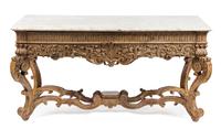 A Louis XIV Carved Console Table Height 32 1/2 x width 64 1/2 x depth 29 3/4 inches. — CIRCA 1720