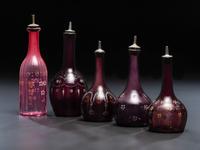 Five Enameled Glass Barber Bottles
