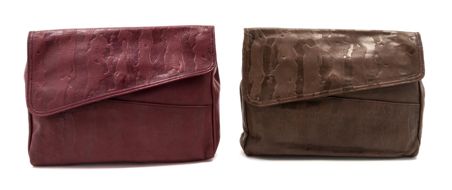 Two Prada Embossed Leather Oversized Clutches, 13 x 9 x 2 inches.
