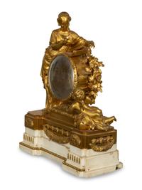 A Louis XVI Gilt Bronze Mounted Marble Mantel Clock