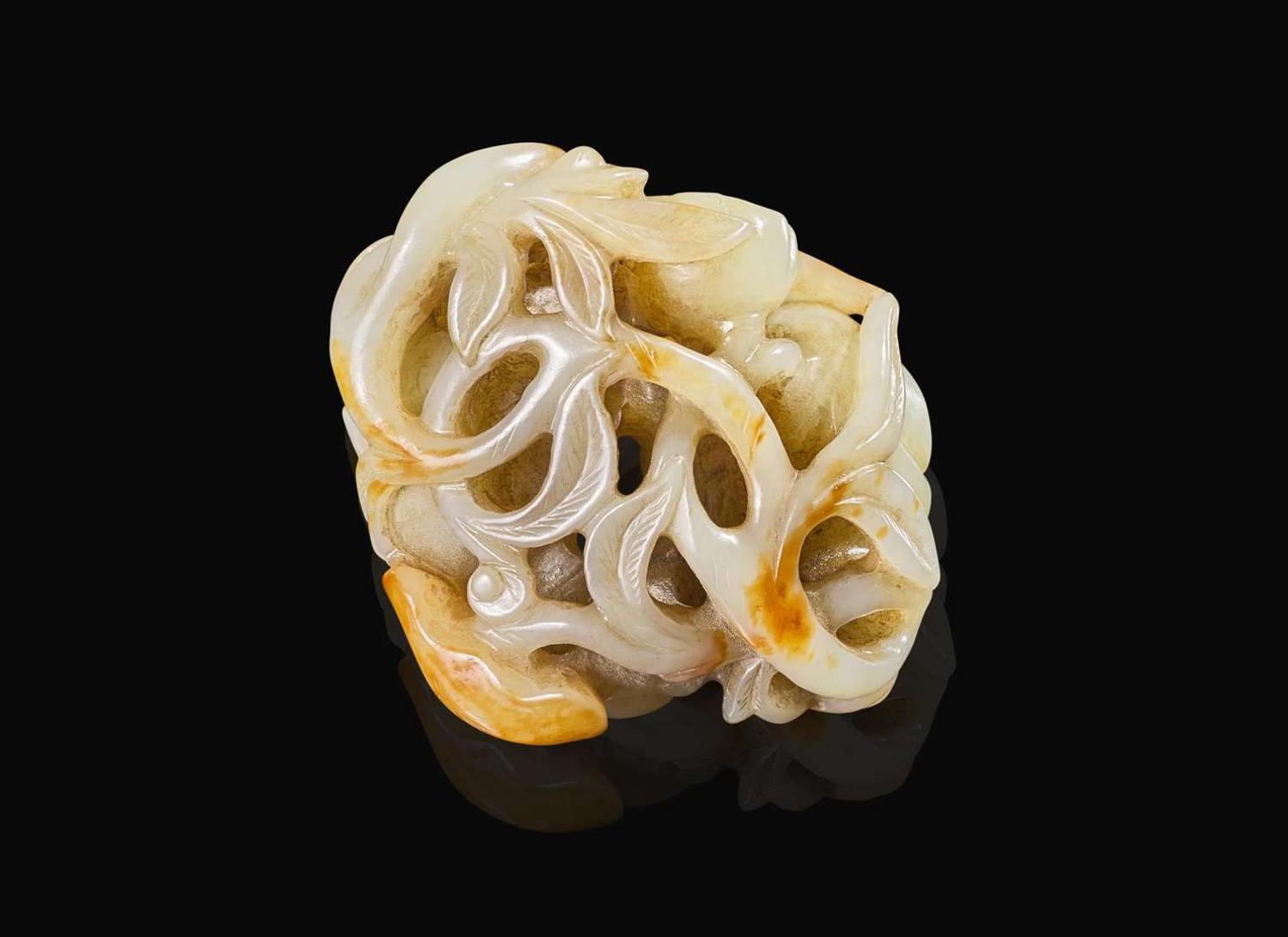 A Chinese carved pale celadon and russet jade "Lotus" group, Qing dynasty 青白玉荷蓮玉雕 清