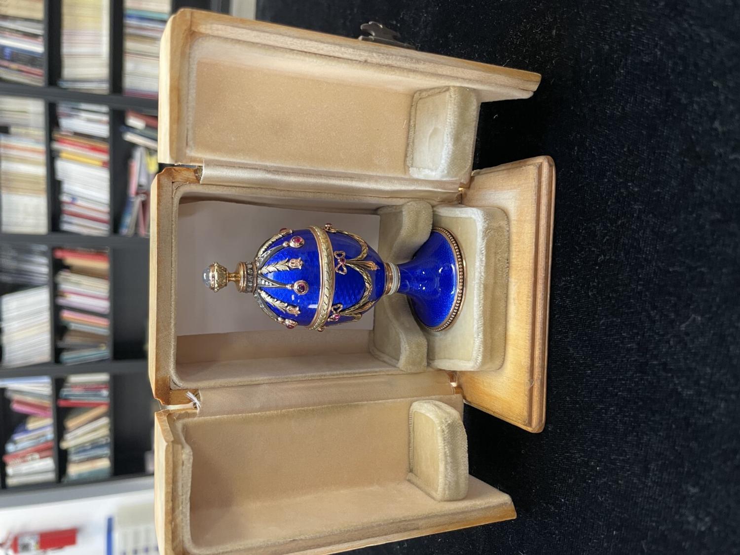 A 14 Karat Vari-Color Gold, Guilloché Enamel, Diamond, and Cabochon Jewel-Mounted Egg-Form Perfume and a Related Guilloché Enamel, 14 Karat Vari-Color Gold, Diamond, and Cabochon-Mounted Surprise Egg