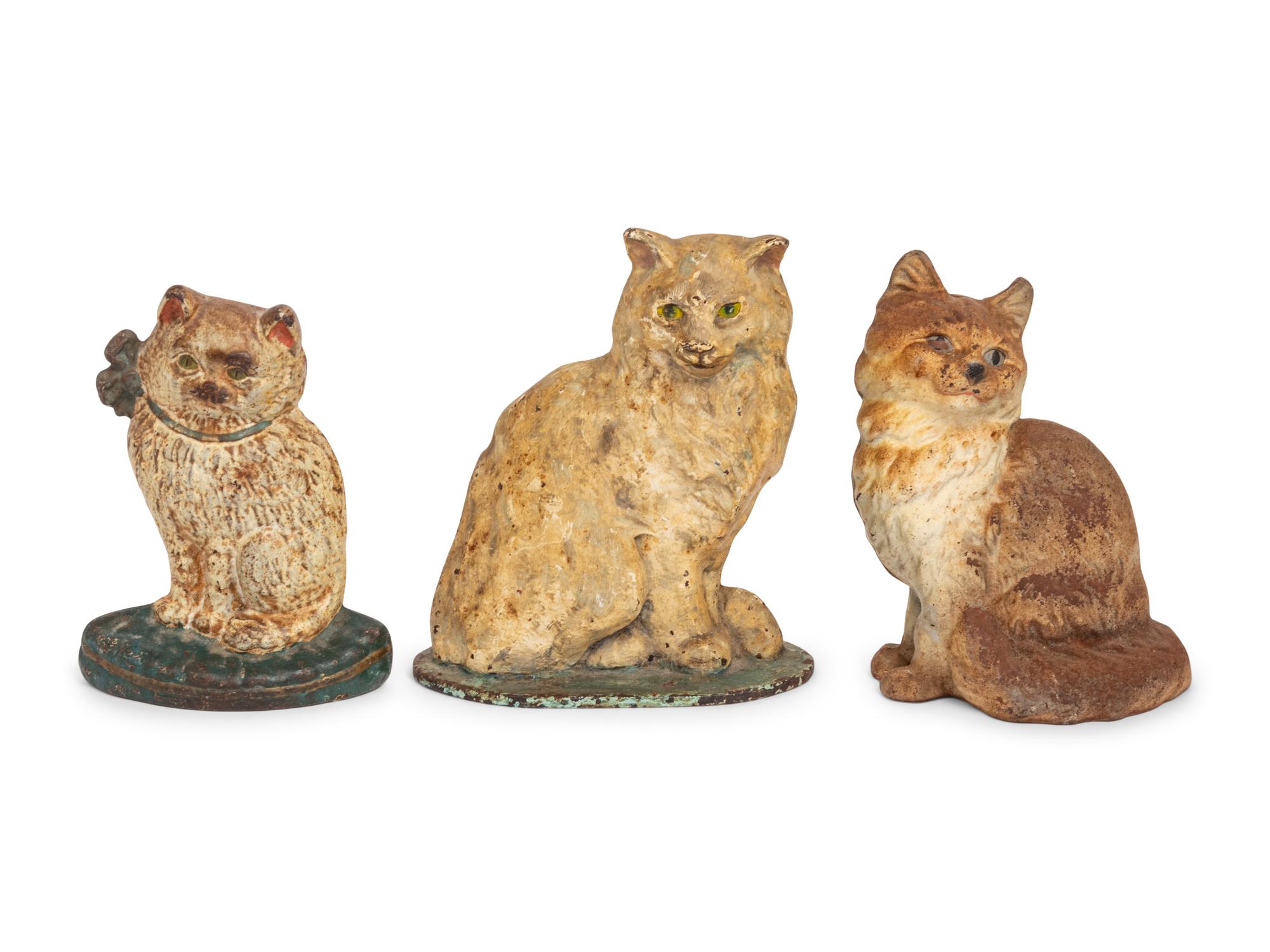 A Group of Three Painted-Iron Cat Form Door Stops
