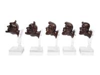 A Set of Five Italian Baroque Carved Walnut Heads of Grotesques