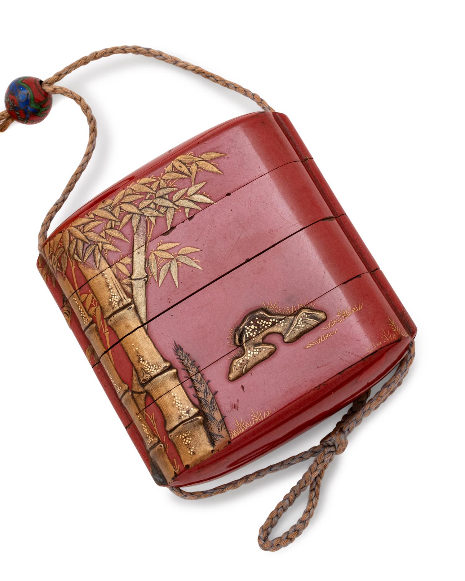 A Gilt and Red Lacquer Three-Case Inro