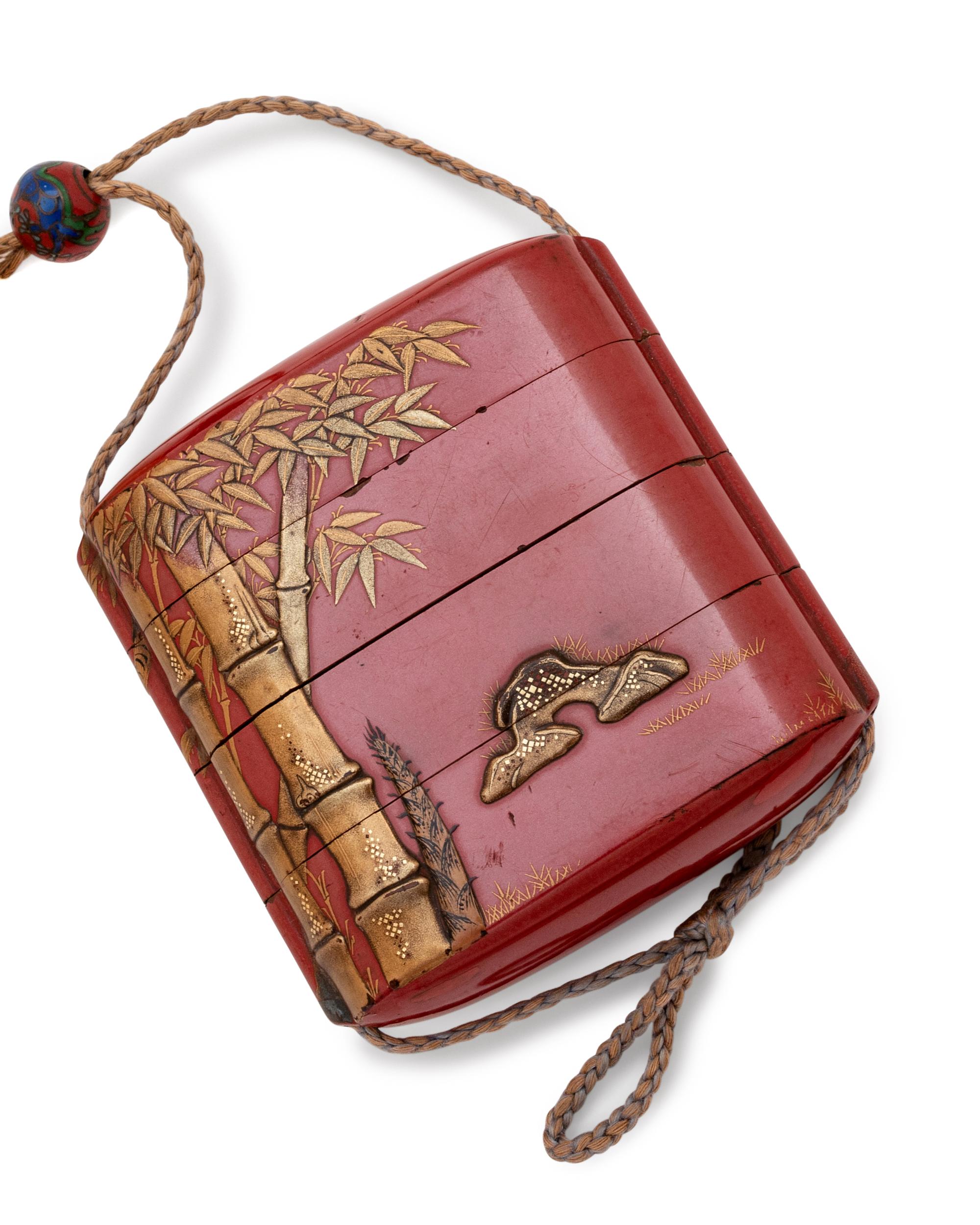A Gilt and Red Lacquer Three-Case Inro