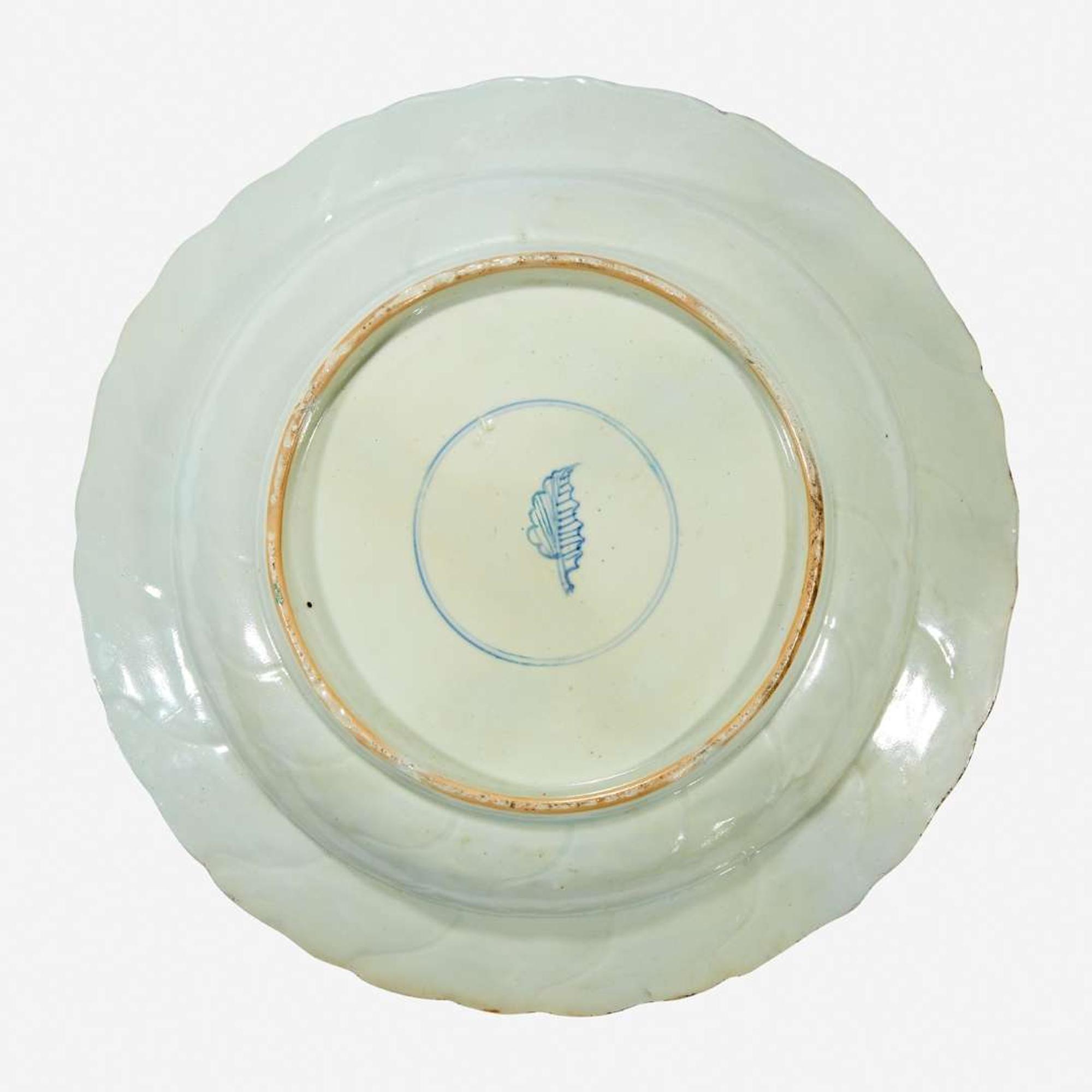 A Chinese famille verte-decorated “Mounted Warriors” charger Kangxi period