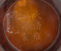 A Transparent Amber-Tone Glass Bottle