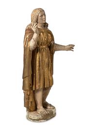 A Continental Painted and Parcel Giltwood Figure