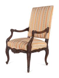 A Régence Style Carved Walnut Fauteuil