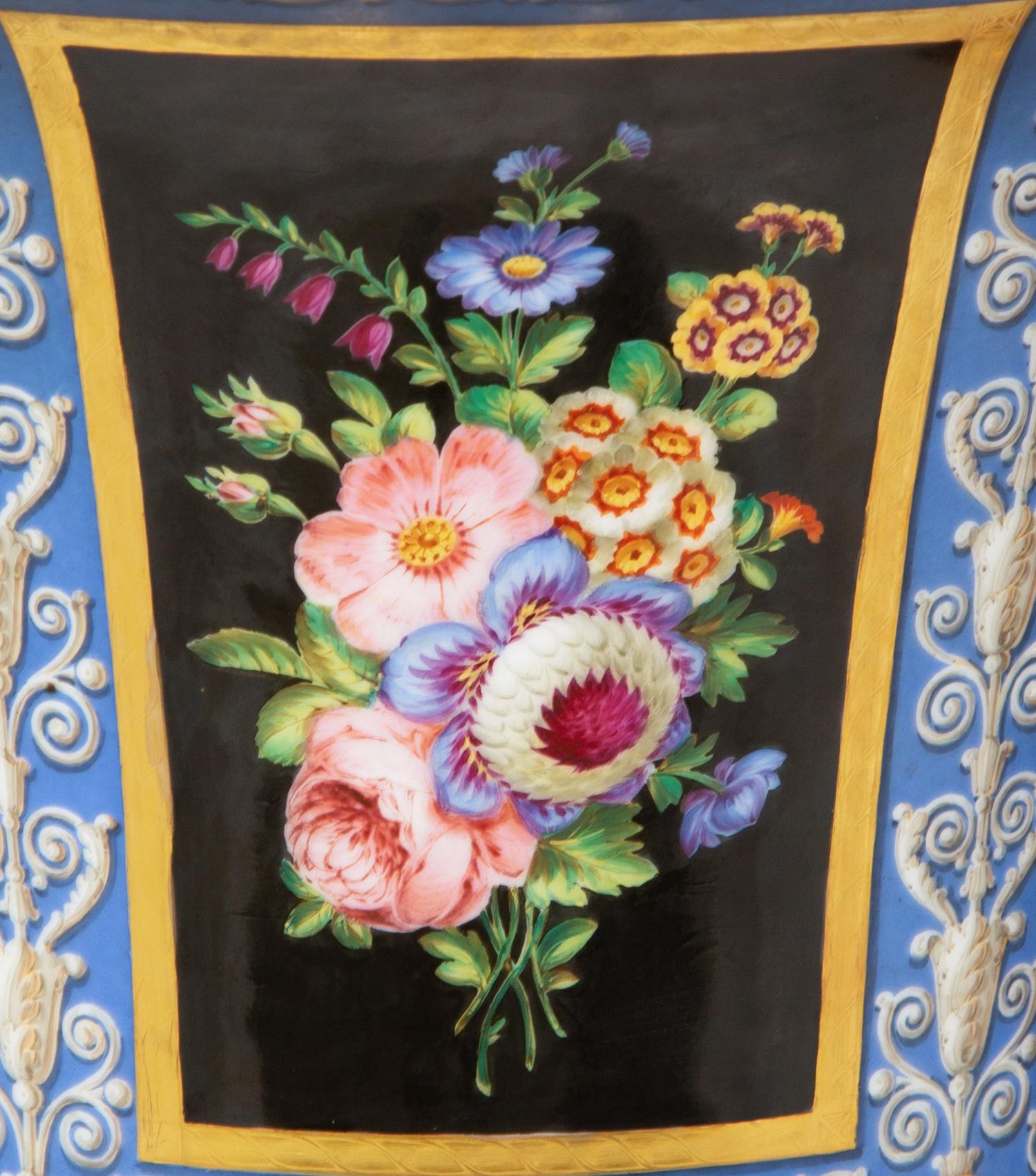 A Pair of Continental Parcel-Gilt and Polychrome Painted Porcelain Urns