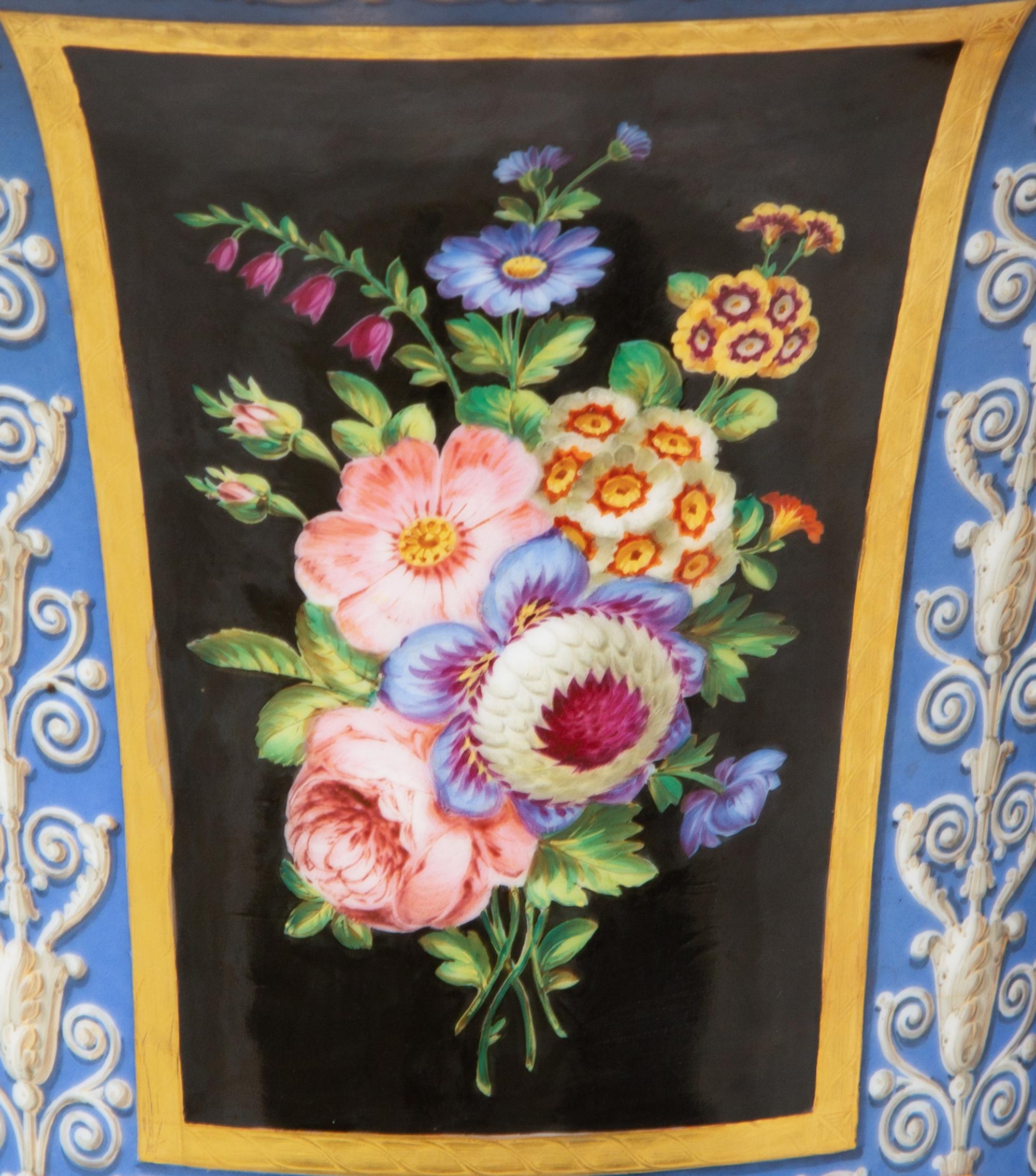 A Pair of Continental Parcel-Gilt and Polychrome Painted Porcelain Urns