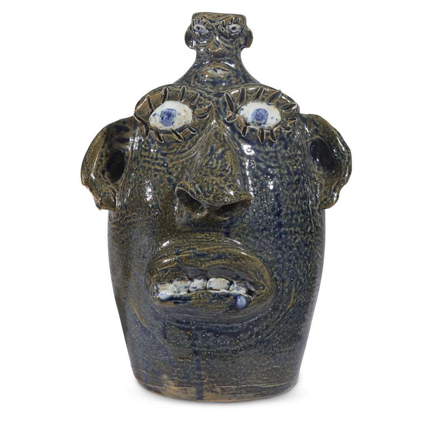 Group of five glazed stoneware face jugs and one figure various artists, Southern States, late 20th century