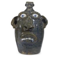 Group of five glazed stoneware face jugs and one figure various artists, Southern States, late 20th century