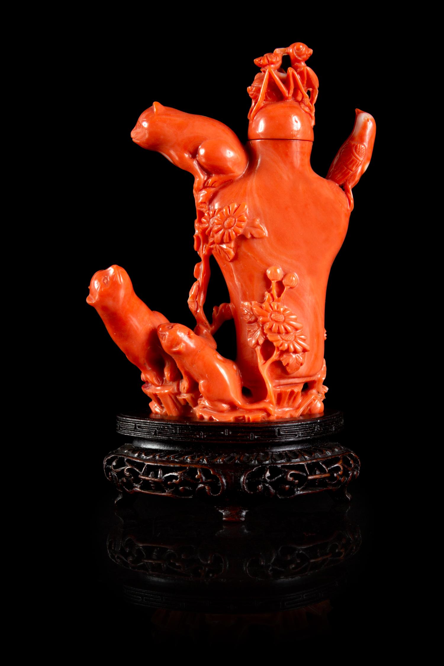 A Carved Red Coral Snuff Bottle