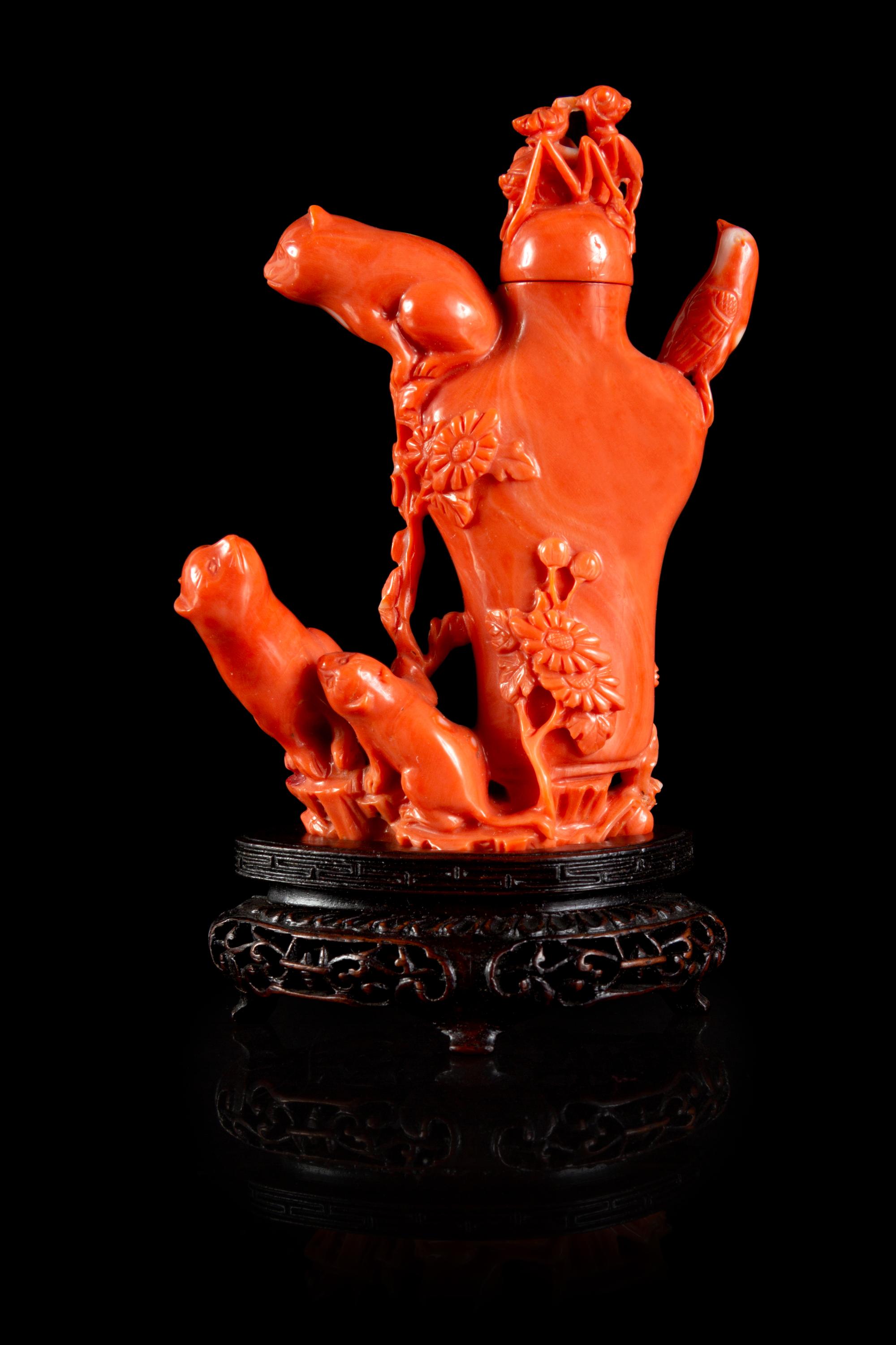 A Carved Red Coral Snuff Bottle