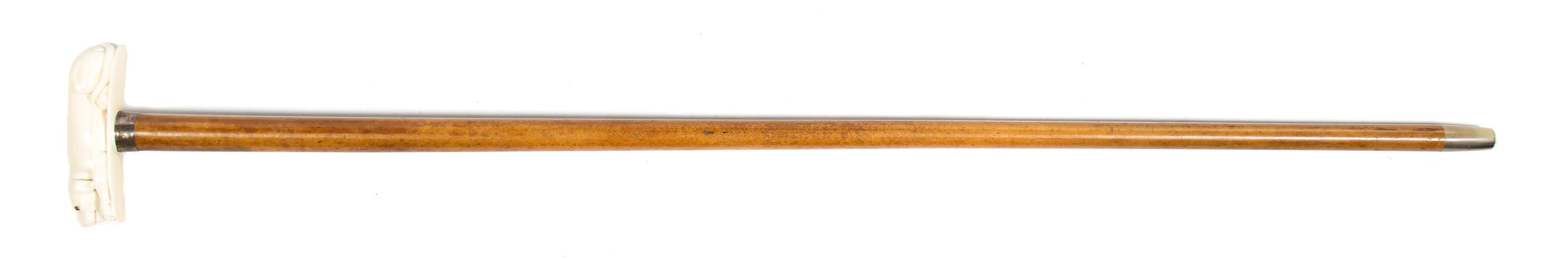A Carved Ivory Animalier Cane Handle, Height overall 38 x width of handle 4 3/4 inches.