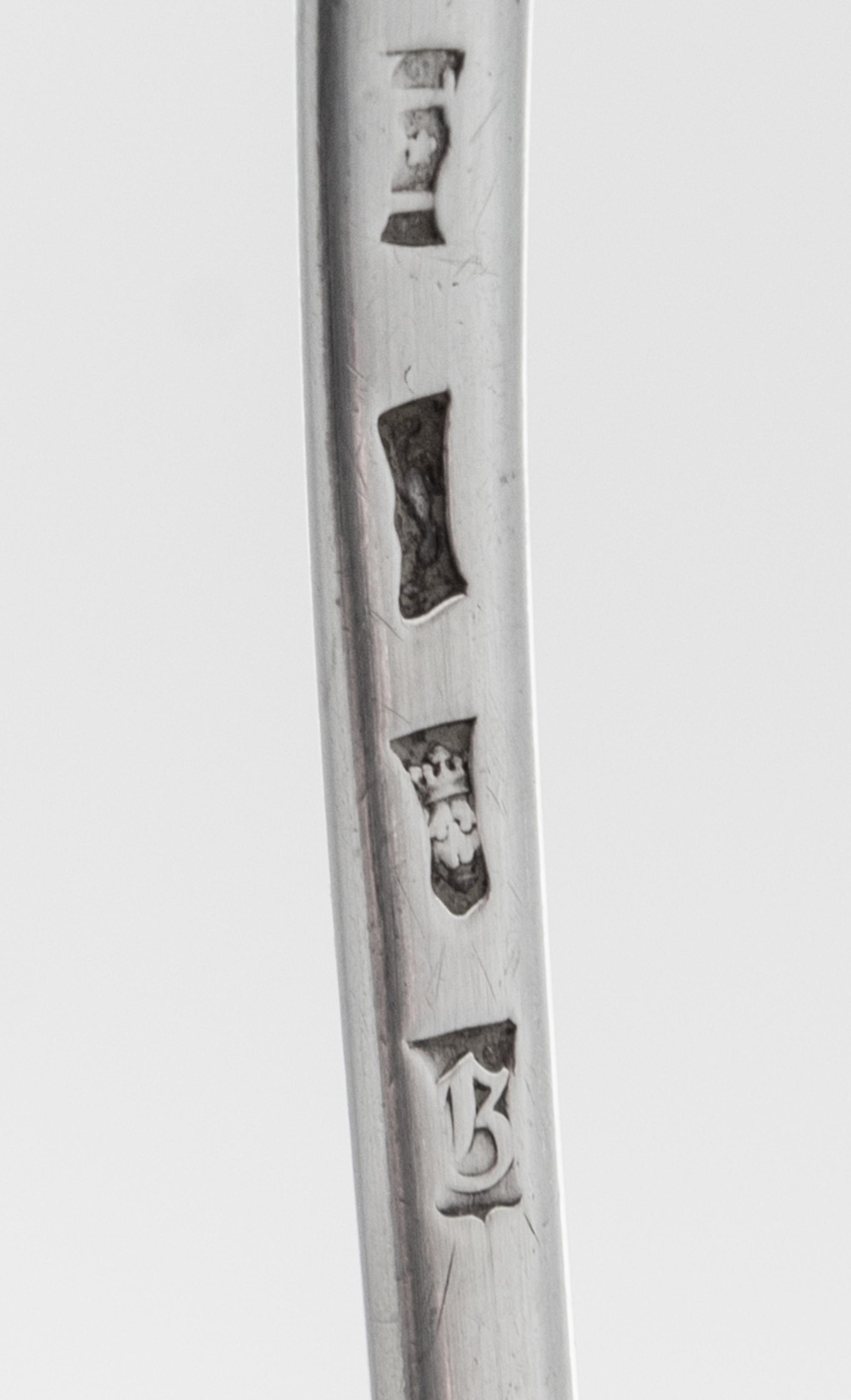 A George III Silver Ladle, Possibly John Innocent, London, 1762, having a shell form bowl, the handle with a volute terminal.
