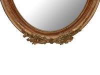 A Napoleon III Giltwood Oval Mirror