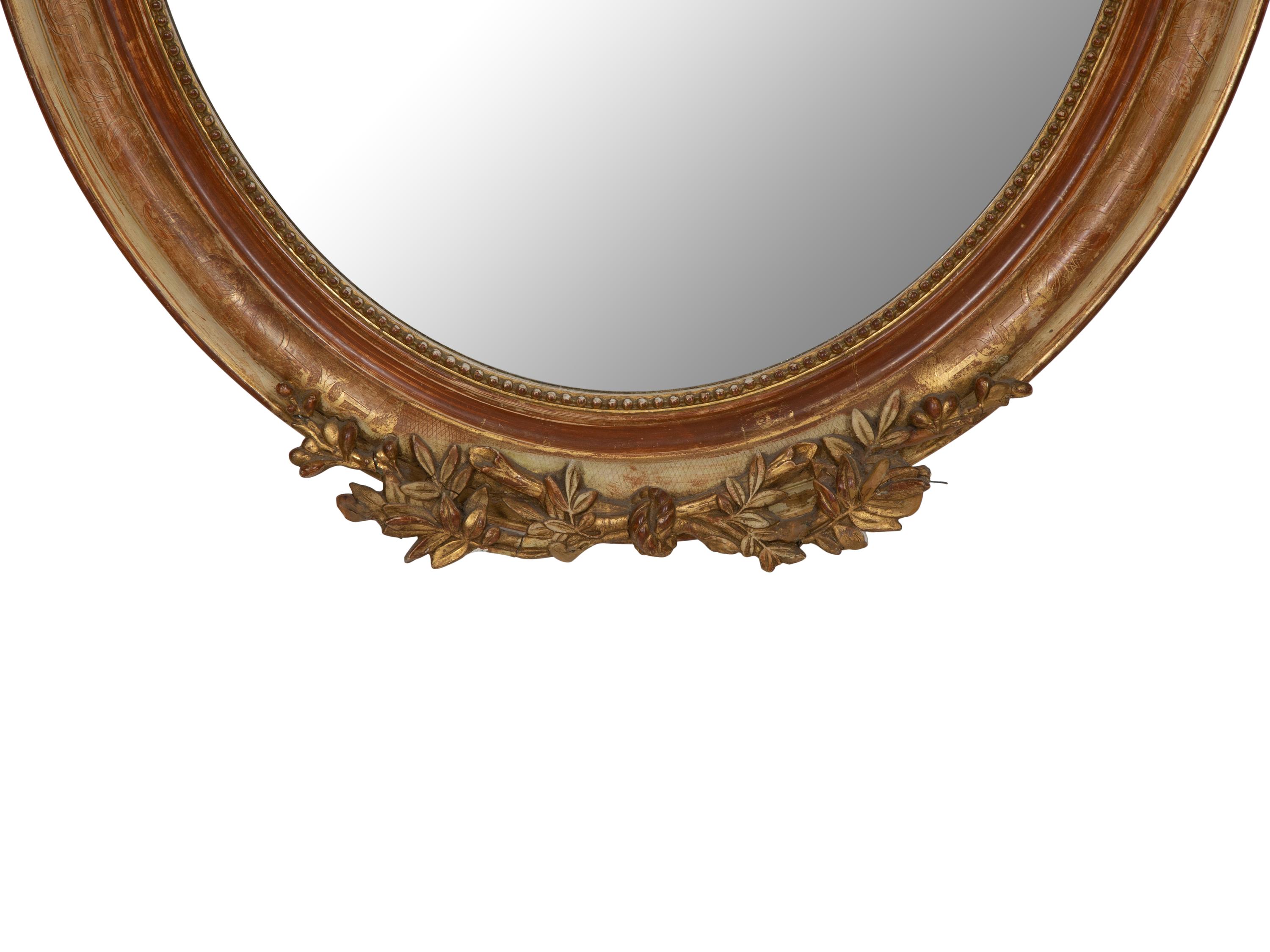 A Napoleon III Giltwood Oval Mirror