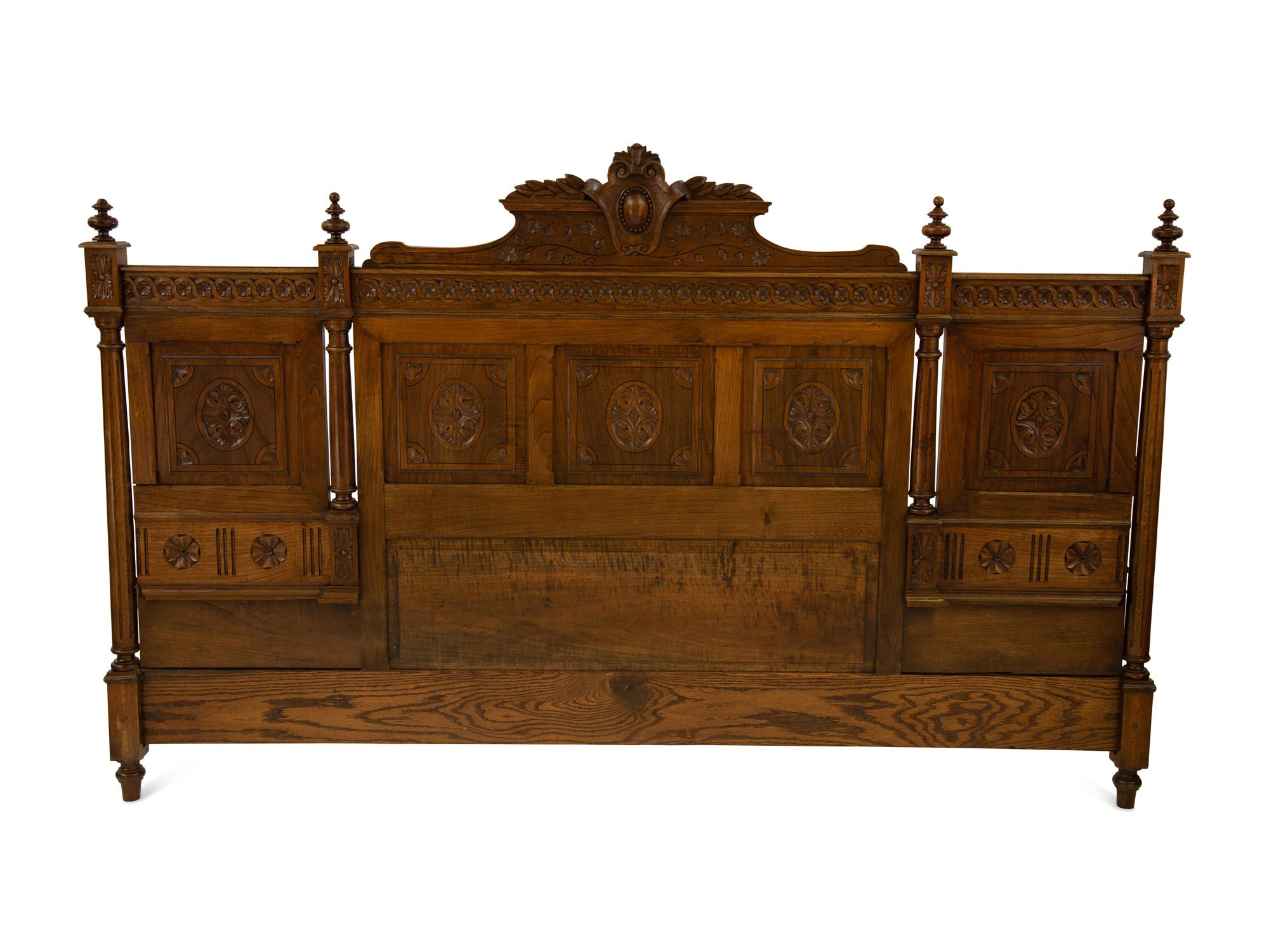 A Renaissance Revival Carved Oak Headboard