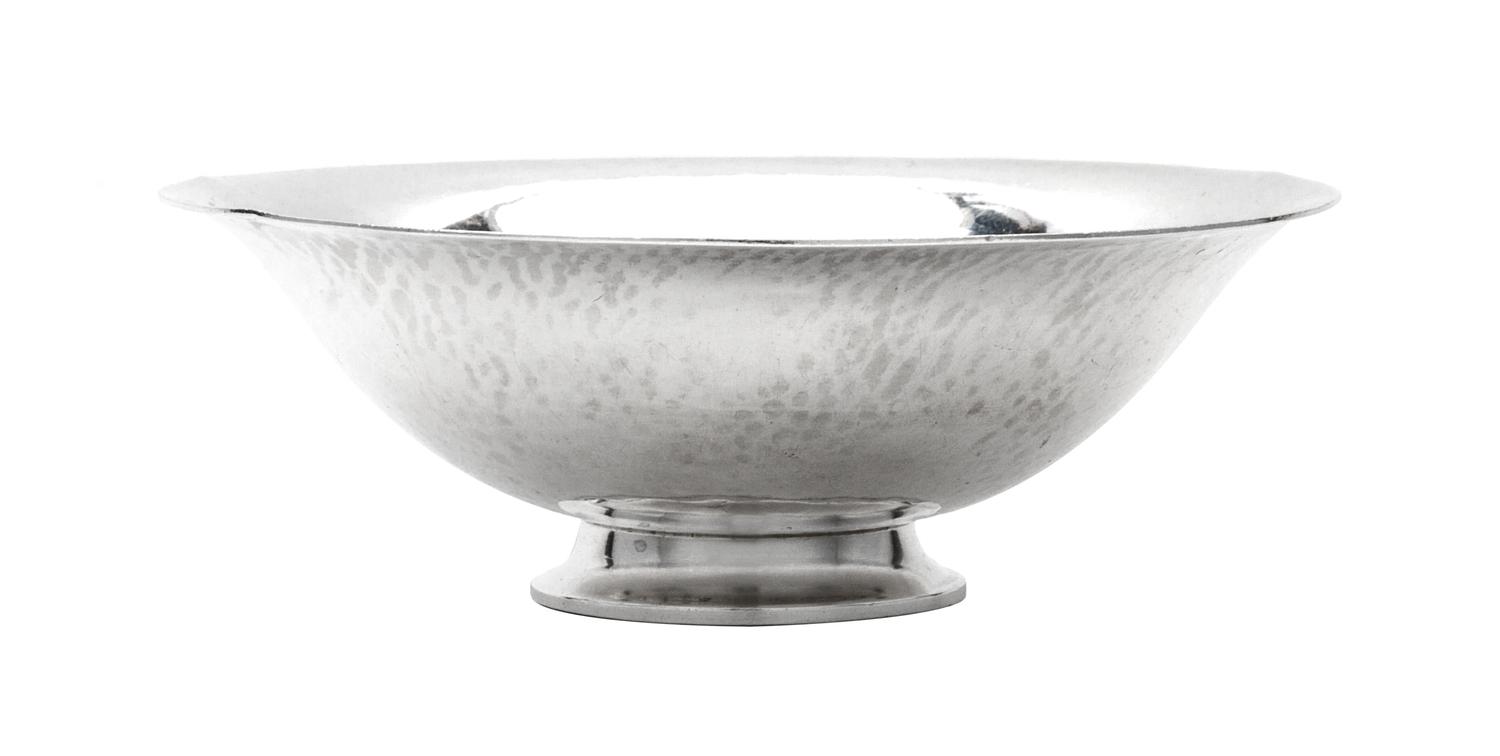 A Danish Silver Bowl, Georg Jensen Silversmithy, Copenhagen, 1933-1944, having a spot hammered finish and raised on a stepped foot.