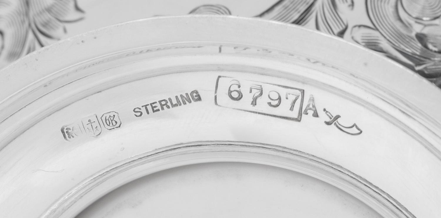 A Set of Twelve American Silver Teacups and Saucers